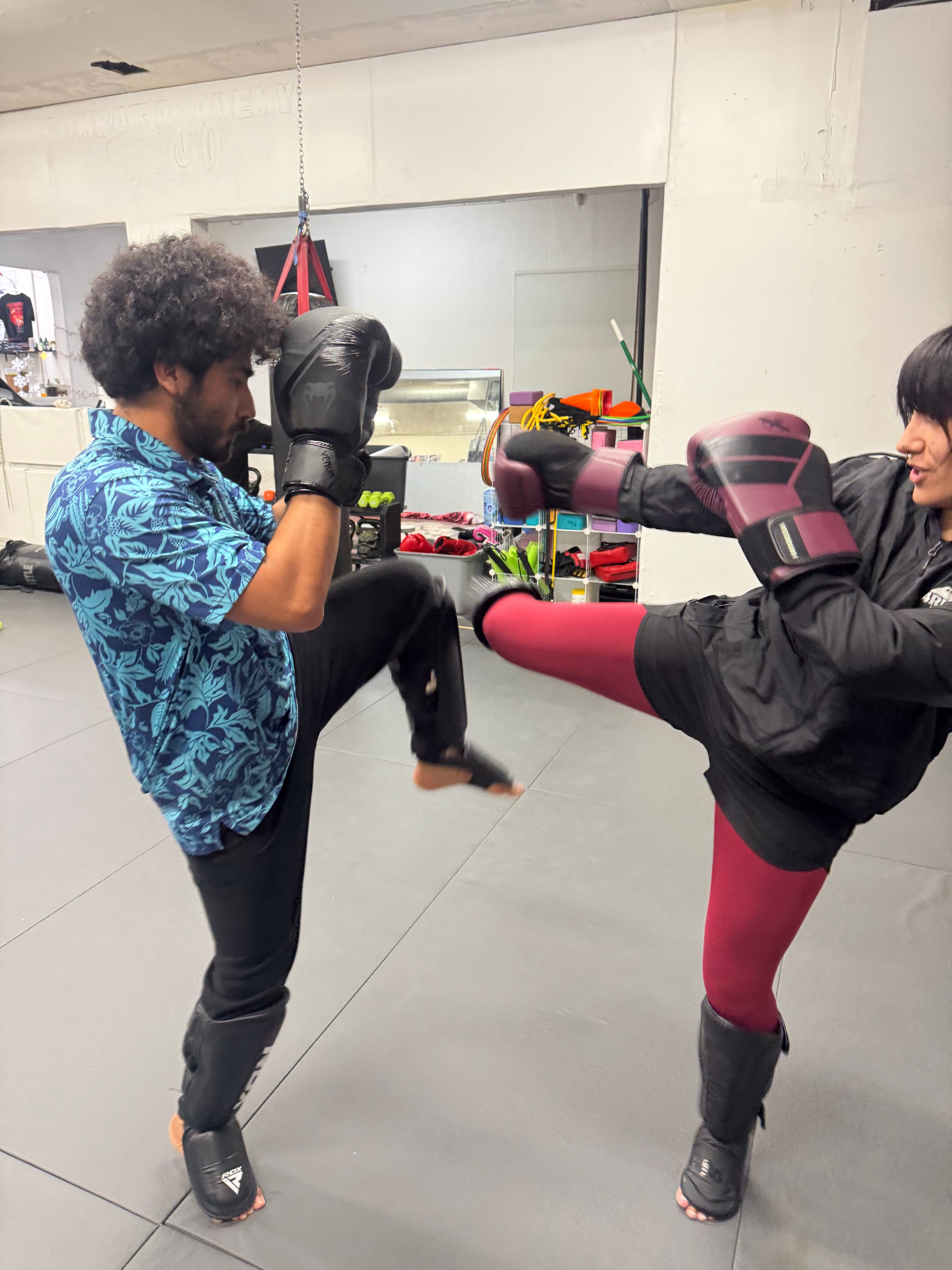 Students practicing kickboxing technique