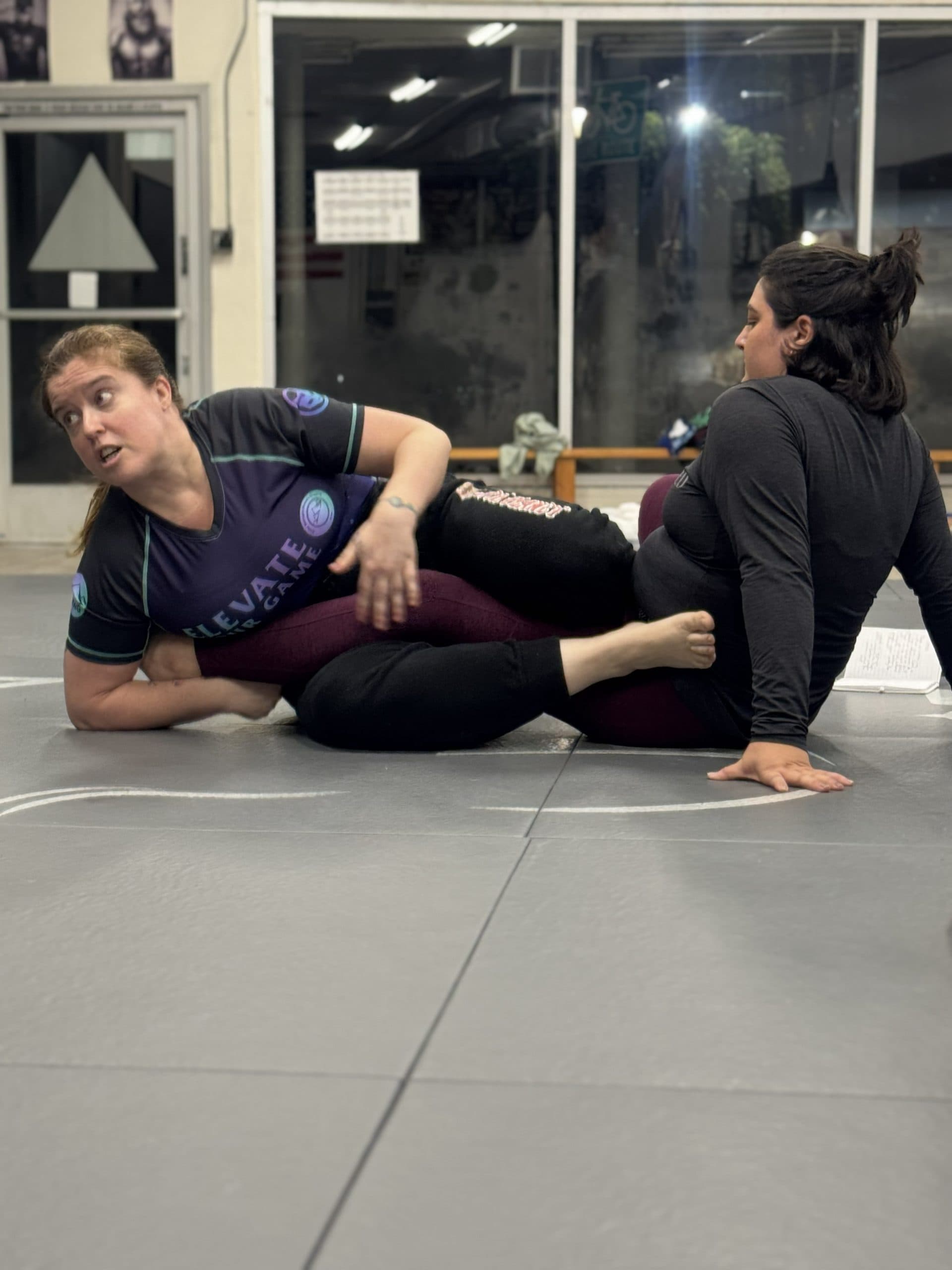Women learning practical self-defense techniques