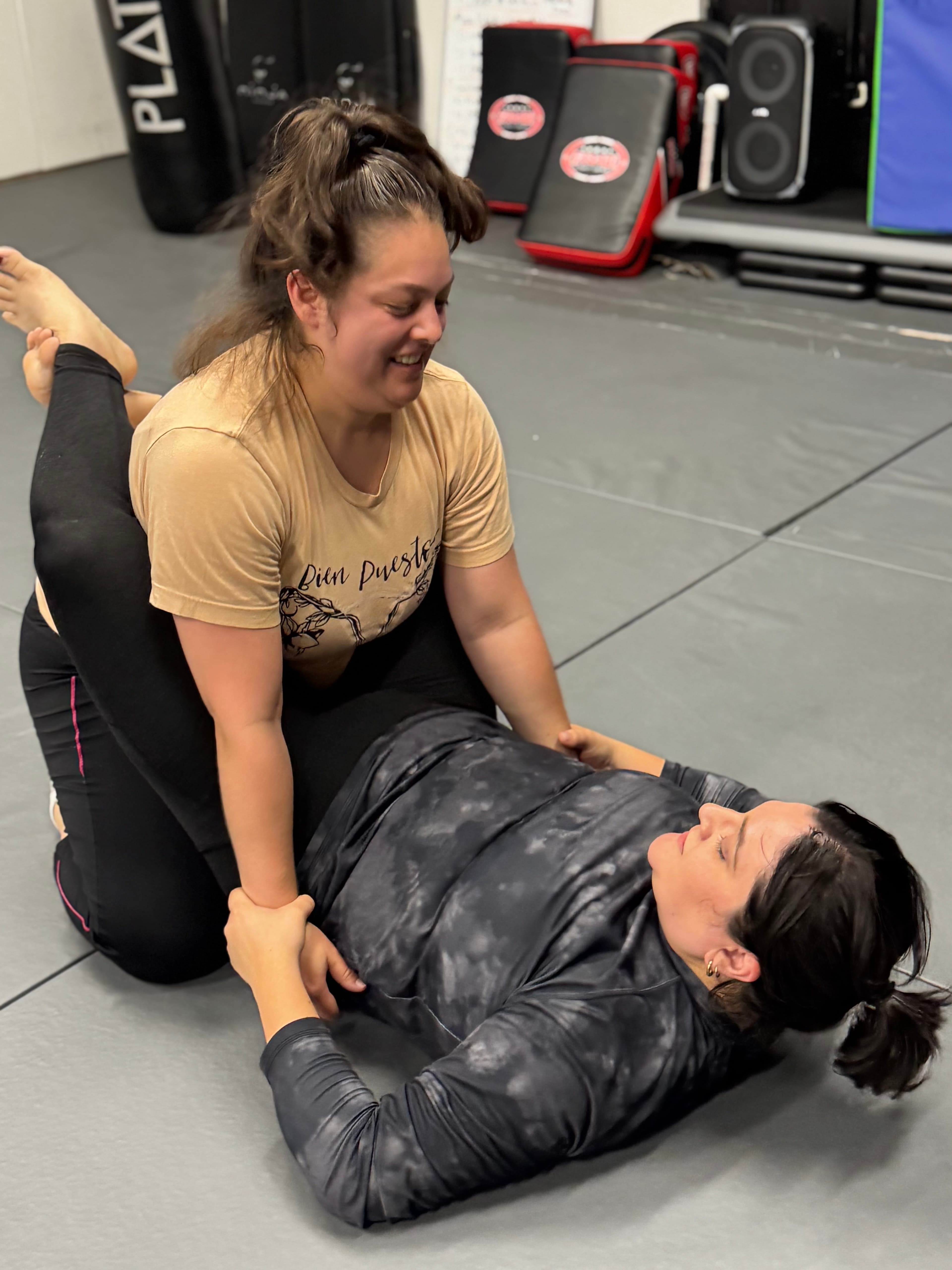 Women learning practical self-defense techniques